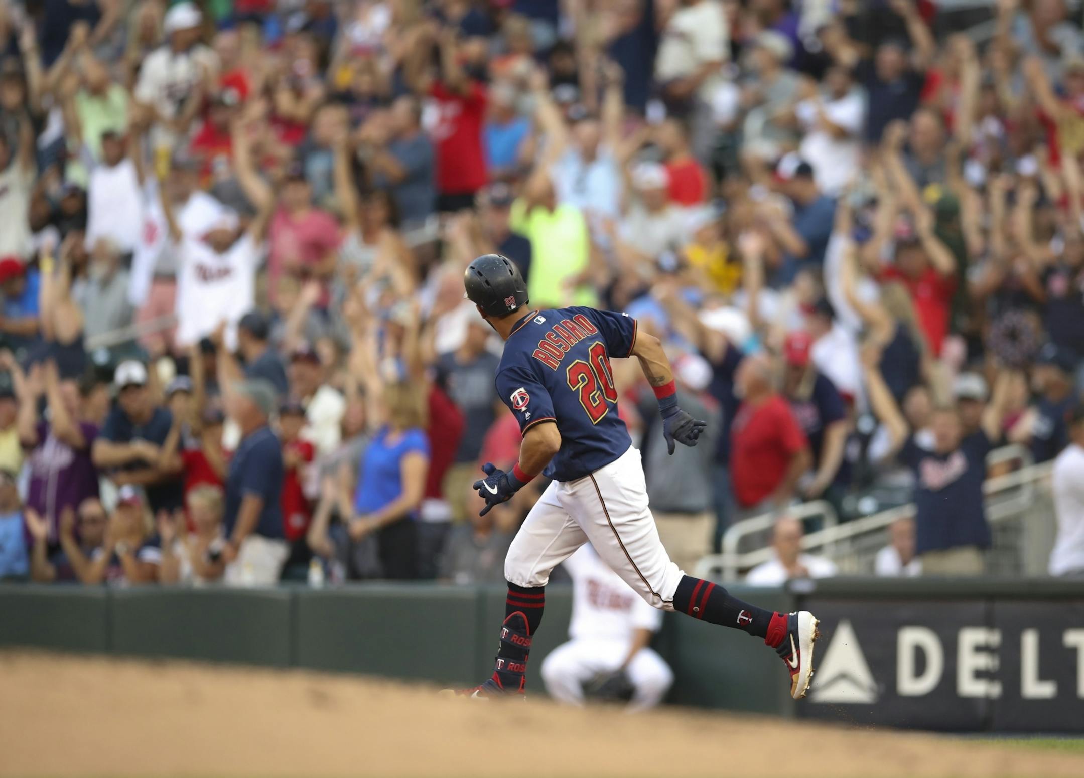 Minnesota Twins left fielder Eddie Rosario looked towards the cheering fans after he hit a two run homer in the first inning off the Yankees' J.A. Happ.