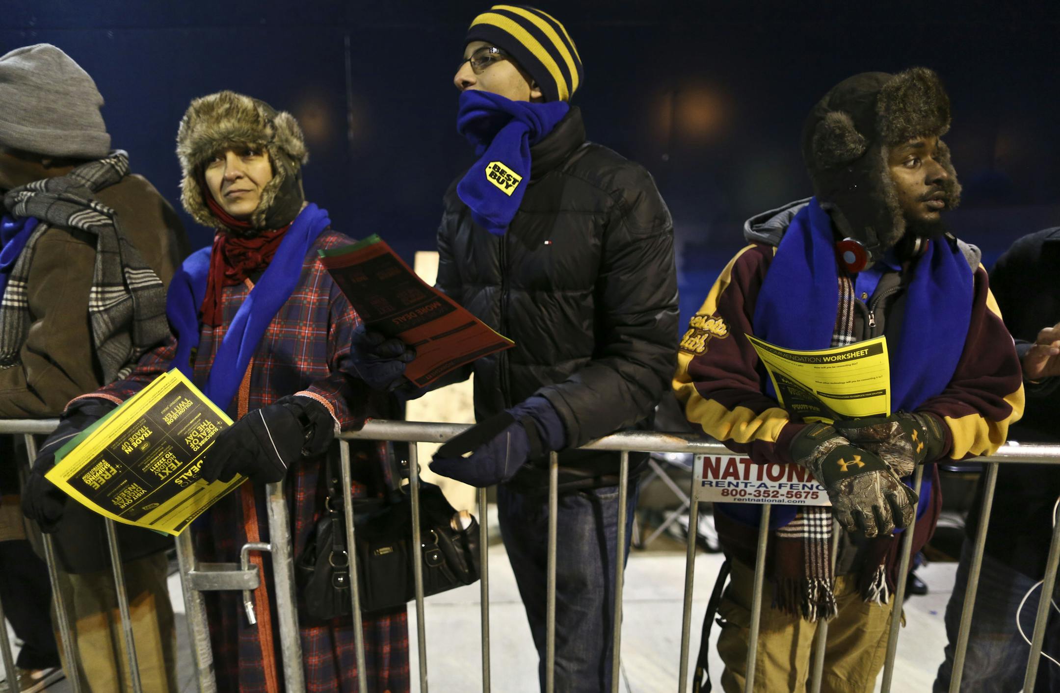 Some people had been in line in the cold weather since 9 a.m. like Soha Attia (left) and her son Sharif (center) who stood in line before the doors opened for Black Friday shopping at 6 p.m. at Best Buy on Thursday, November 28, 2013 in Roseville, Minn. ] RENEE JONES SCHNEIDER &#x2022; reneejones@startribune.com