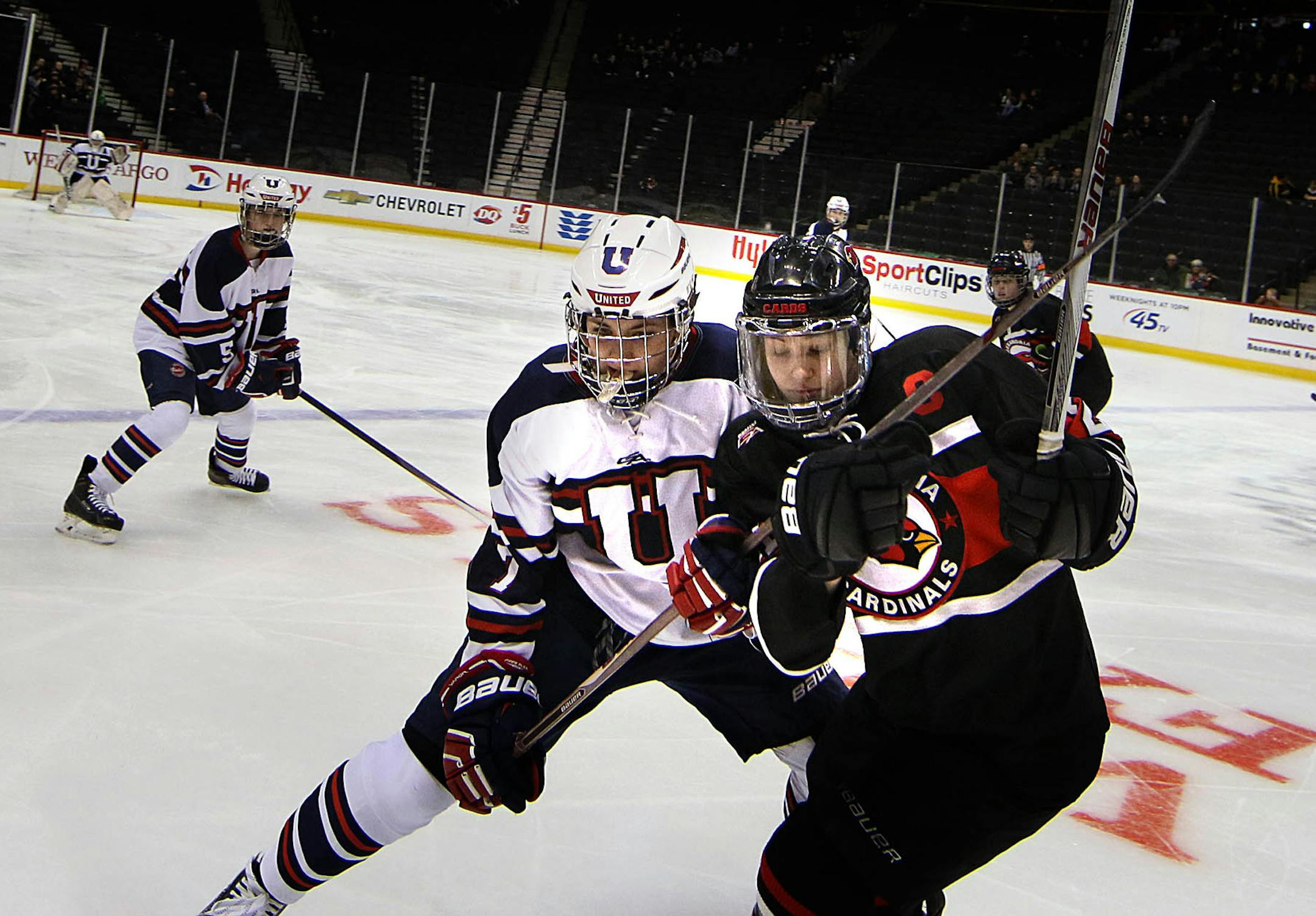 St. Paul Unitedís Sena Hanson (left) and Alexandriaís Lauren Niska chased a loose puck in the neutral zone in the first period. ] JIM GEHRZ ï james.gehrz@startribune.com / St. Paul, MN / February 17, 2016 /1:00 PM ñ BACKGROUND INFORMATION: Alexandria Area High School played St. Paul United in the Class 1A quarterfinals at the Xcel Energy Center at the 2016 Girls' hockey state tournament. St. Paul United won the game, 2-0.