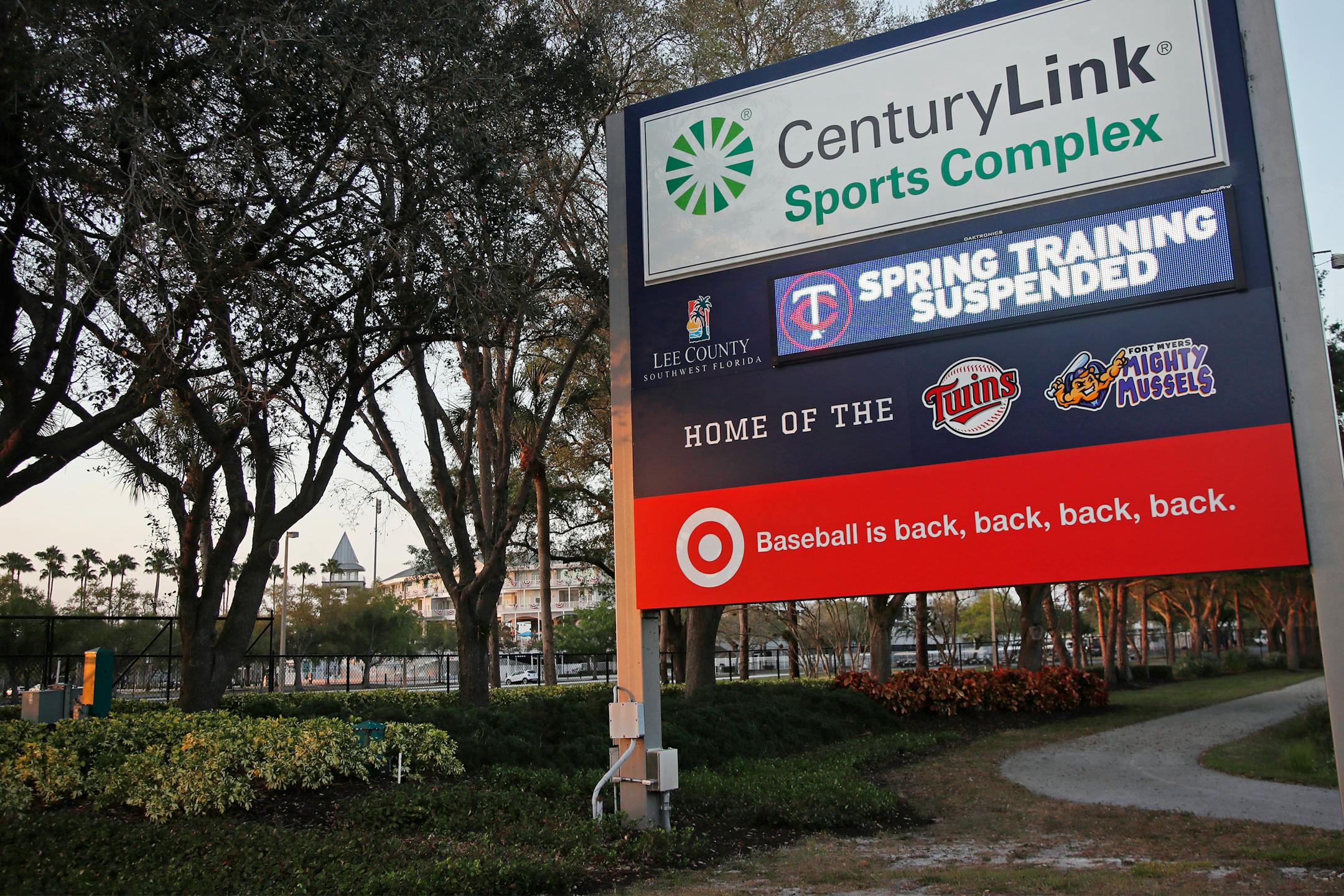 A sign outside Hammond Stadium reads "spring training suspended" after a baseball game was cancelled between the Minnesota Twins and the Baltimore Orioles, Thursday, March 12, 2020, in Fort Myers, Fla. Major League Baseball has suspended the rest of its spring training game schedule because if the coronavirus outbreak. MLB is also delaying the start of its regular season by at least two weeks. (AP Photo/Elise Amendola)