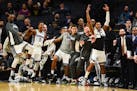 The Sacramento bench players reacted after Kings guard Bogdan Bogdanovic made a jump shot to take an improbable lead in overtime against the Timberwol