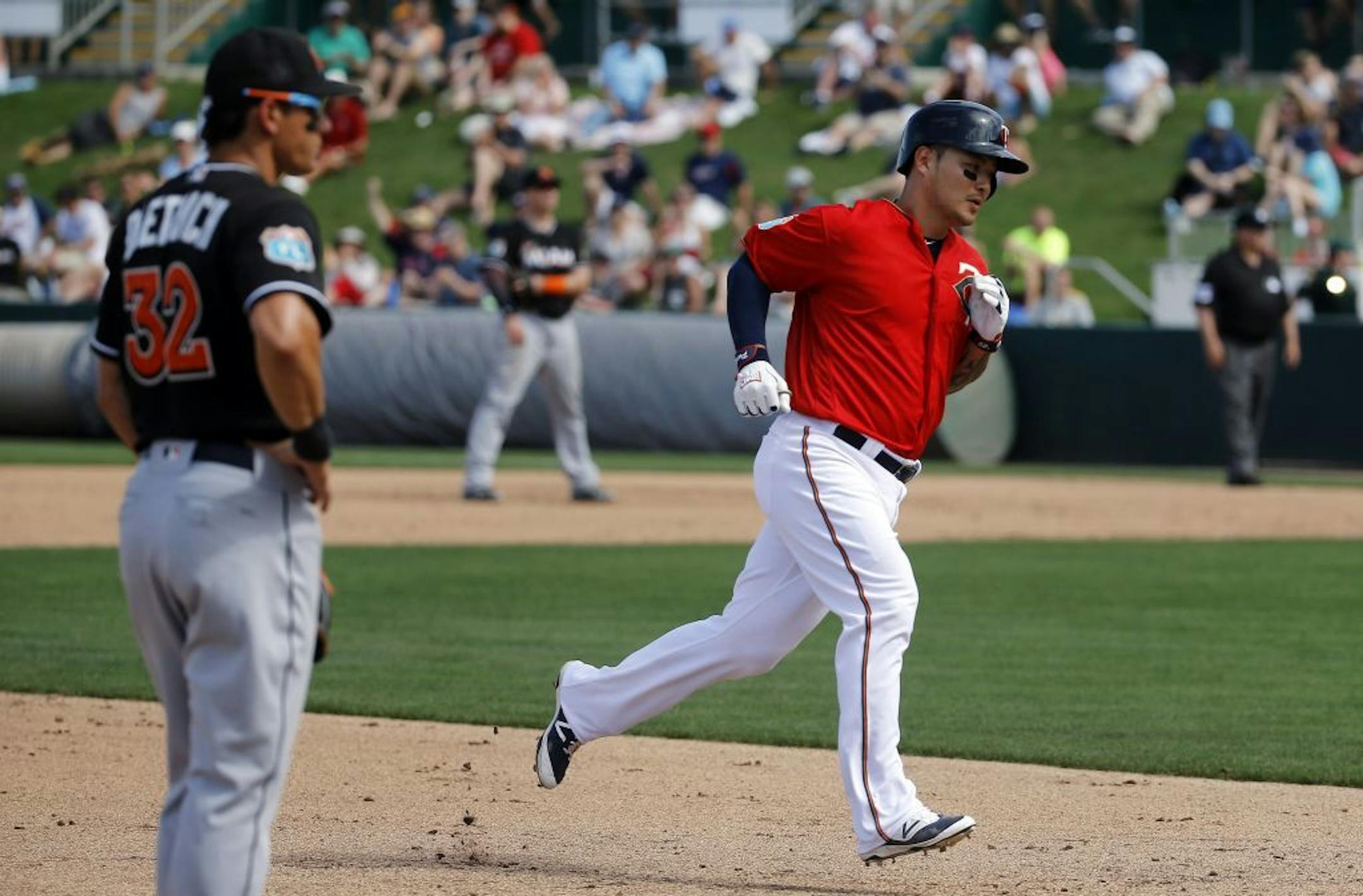 Minnesota Twins' Byung Ho Park, of South Korea, rounds the bases after hitting a solo home run in the fourth inning of a spring training interleague baseball game against the Miami Marlins in Fort Myers, Fla., Friday, March 11, 2016.