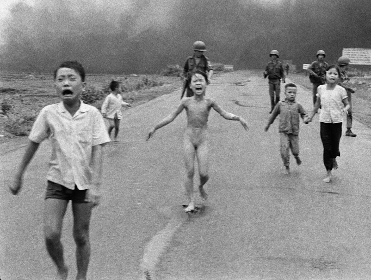 FILE - In this June 8, 1972 file photo, crying children, including 9-year-old Kim Phuc, center, run down Route 1 near Trang Bang, Vietnam after a South Vietnamese plane accidentally dropped its flaming napalm on South Vietnamese troops and civilians.