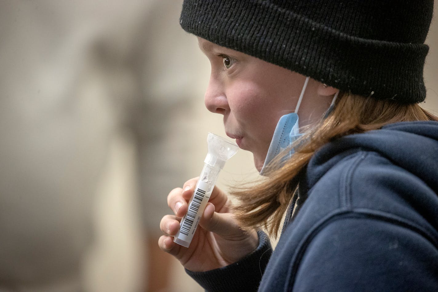 Amelia Smith, 12, took a test at the new saliva COVID-19 testing site at the Minneapolis-St. Paul International Airport on Thursday, Nov.12, 2020.