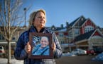 Joan Maurer holds a photograph of her late father Gerald Seeger. After he died, a senior home in Columbia Heights tried to block Maurer from suing the