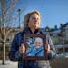Joan Maurer holds a photograph of her late father Gerald Seeger. After he died, a senior home in Columbia Heights tried to block Maurer from suing the
