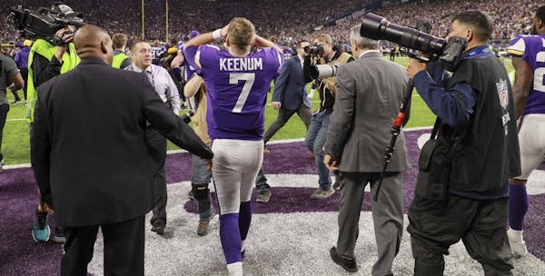 Vikings quarterback Case Keenum walks off the field in disbelief after Stephon Diggs caught his pass to score a game winning TD as time ran out. ] BRI