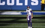 Minnesota Vikings quarterback Kirk Cousins (8) looks up at a replay on the scoreboard during an NFL football game between the Indianapolis Colts and M