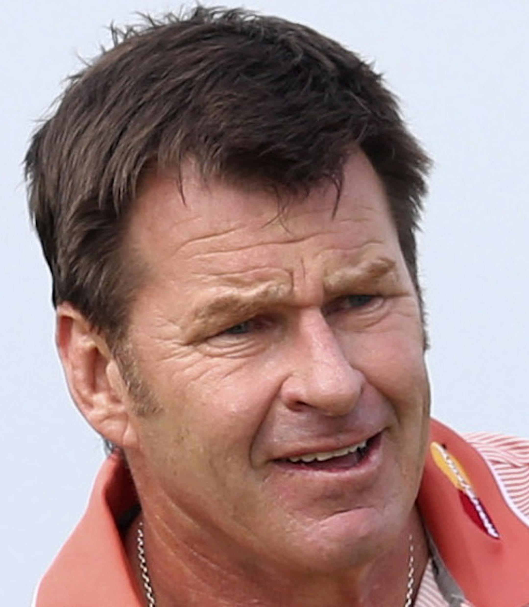Nick Faldo of England plays a shot off the 6th tee as Tom Watson of the United States looks on during the first round of the British Open Golf Championship at Muirfield, Scotland, Thursday July 18, 2013. (AP Photo/Scott Heppell)