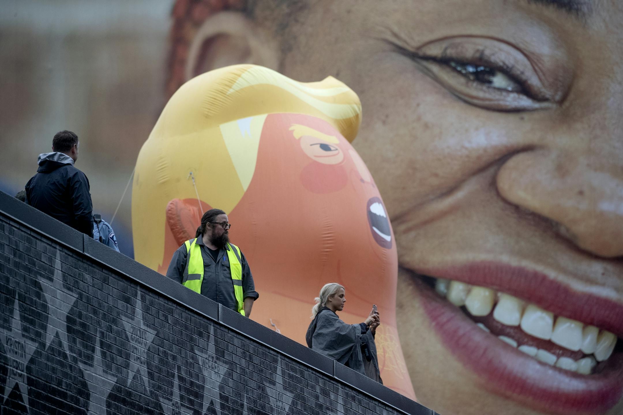The giant "Baby Trump" balloon on top of First Avenue caught the attention of many protestors outside the Target Center before President Trump's visit, Thursday, October 10, 2019 in Minneapolis, MN.