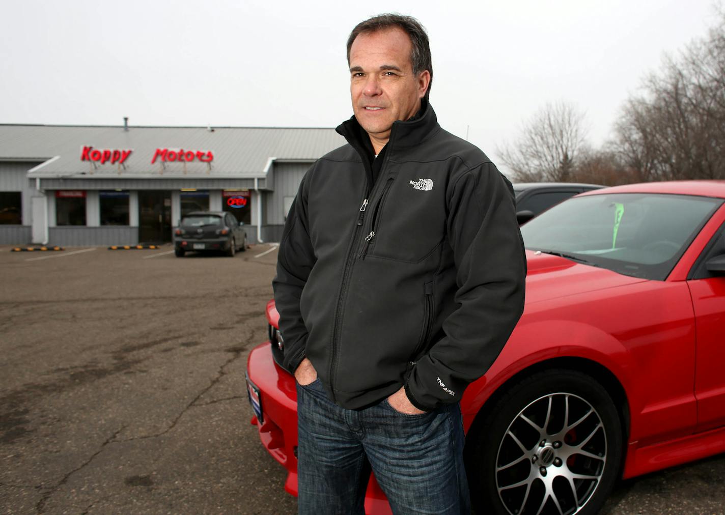 Dan Koppy, of Koppy Motors of Forest Lake, on his lot. Poppy said that he was not for being open on Sundays so that his employees could spend time with their families. ] (KYNDELL HARKNESS/STAR TRIBUNE) kyndell.harkness@startribune.com At Koppy Motors in Forest Lake Min., Wednesday, January 28, 2015.