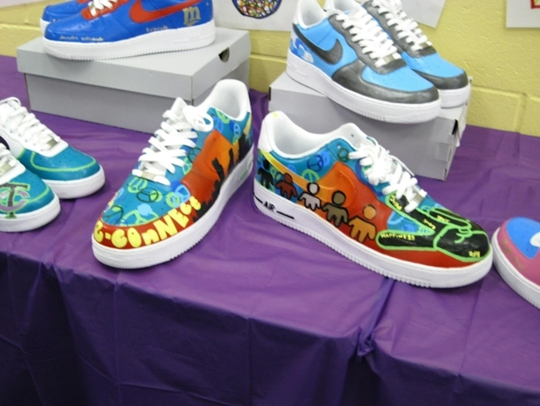 For the YMCA's "Remix Your Kicks" project, youth designed and painted sneakers to represent how they see peace in the city.