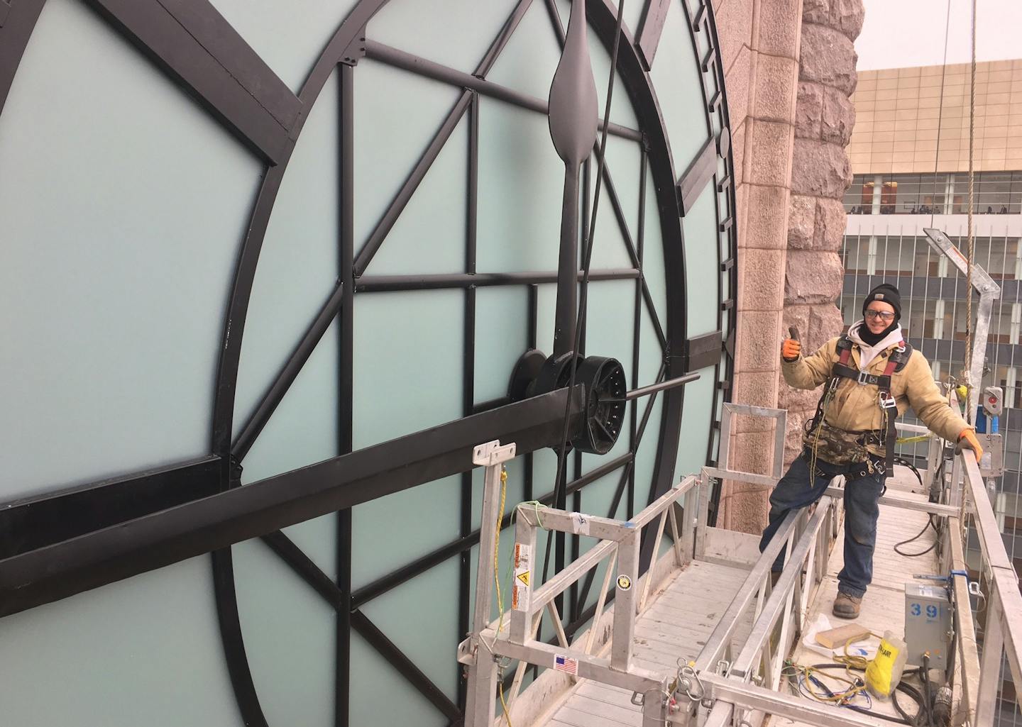 A construction worker outside the east face of the Minneapolis City Hall clock tower on Jan. 24, 2017.