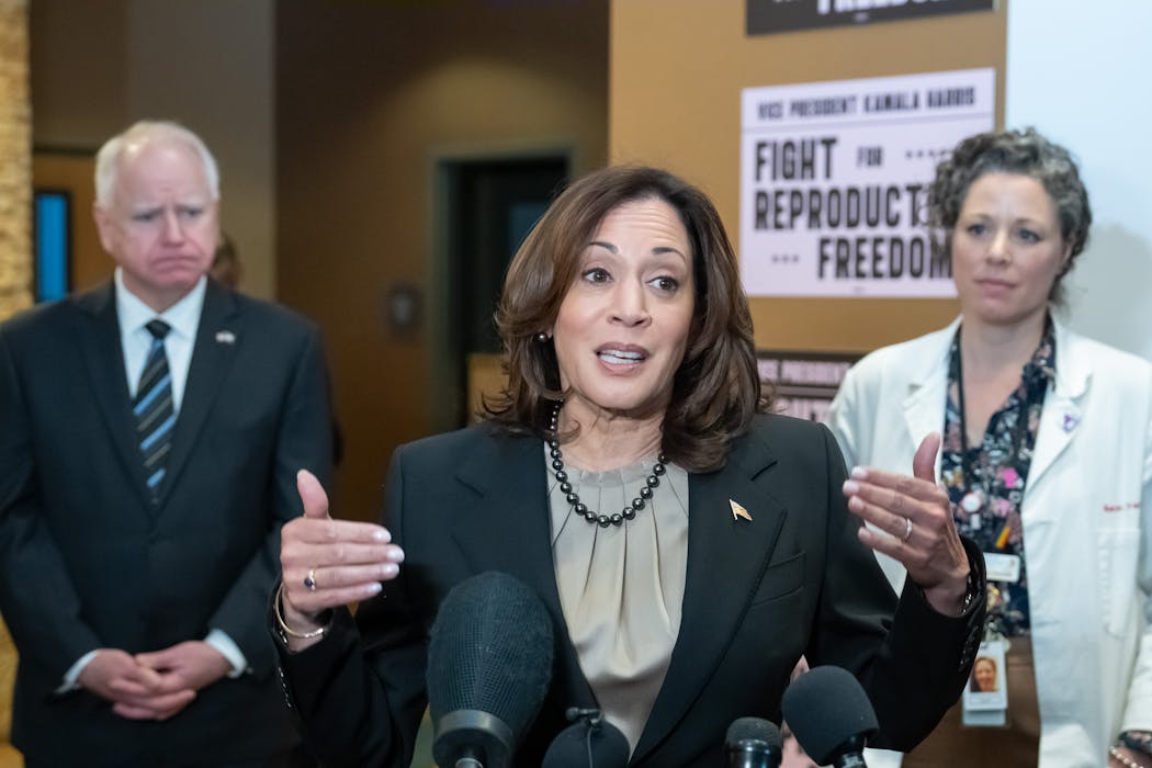 Vice President Kamala Harris addreses the media after touring the Planned Parenthood clinic in St. Paul on Thursday. Behind her are Gov. Tim Walz and Dr. Sarah Traxler, chief medical officer of Planned Parenthood North Central States.
