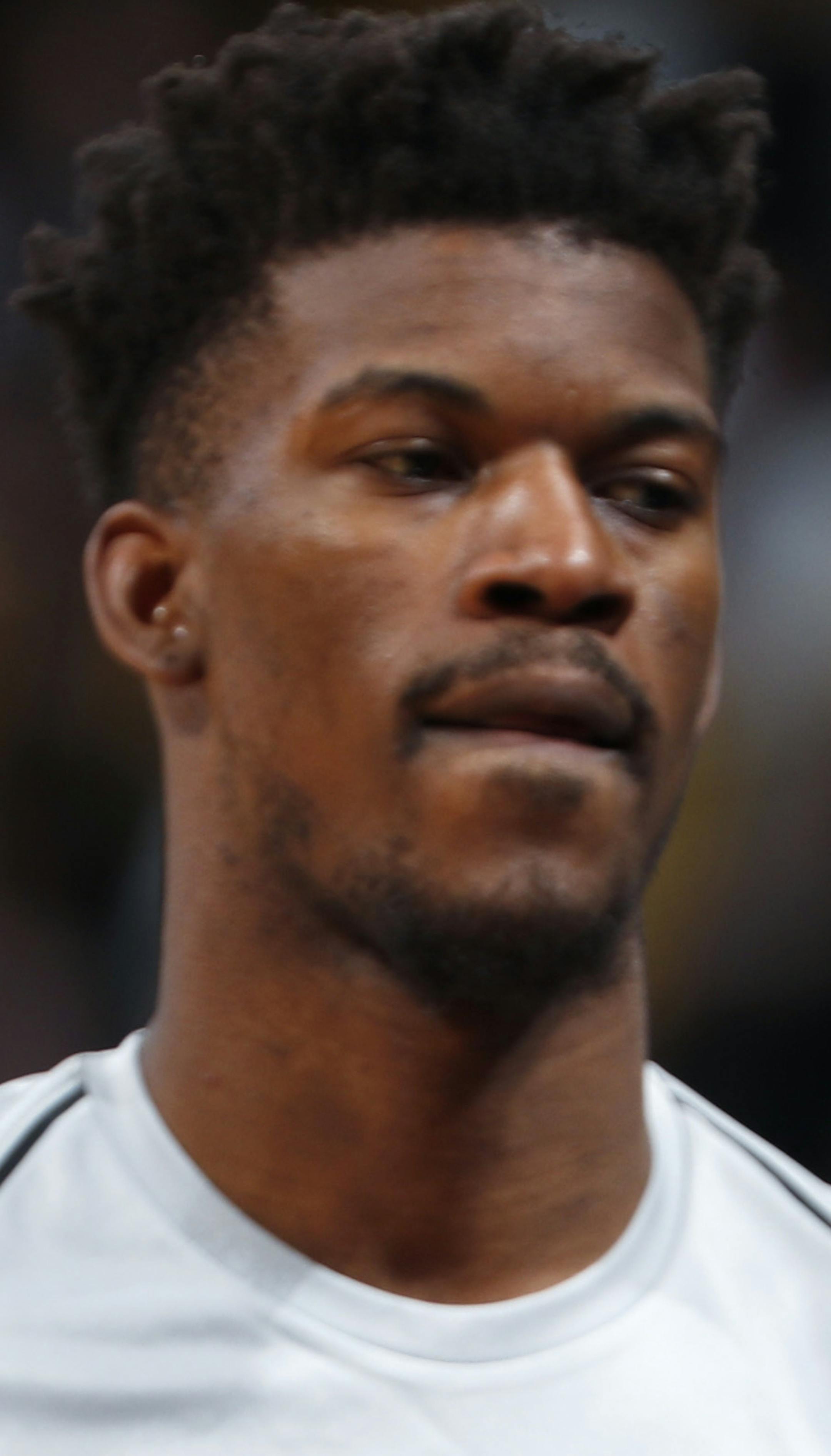 Minnesota Timberwolves guard Jimmy Butler (23) in the first half of an NBA basketball game Thursday, April 5, 2018, in Denver. (AP Photo/David Zalubowski)