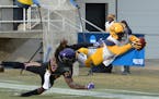 Photo credit: Josh Manck (of Texas A&M-Commerce).
Marquis Wimberly dives past MSU Mankato defender Keyshawn Davis to complete a 30-yard touchdown rece
