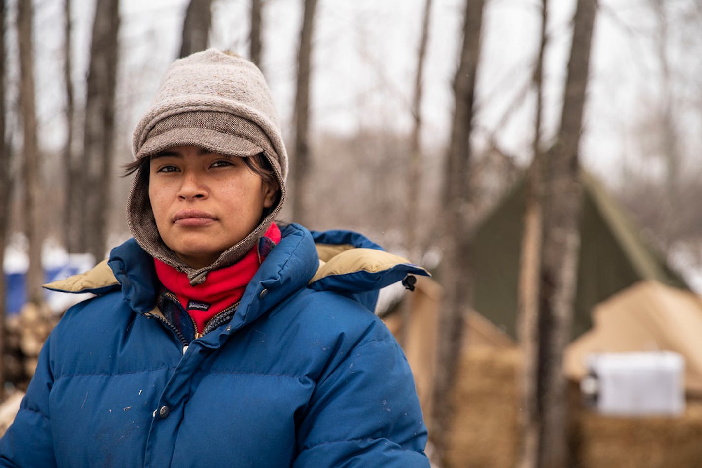 Alex Golden-Wolf walked posed for a portrait inside Camp Migizi. Migizi is a small encampment of mostly indigenous water and land protectors located right beside the Enbridge Line 3 construction site on the Fond Du Lac Native American reservation in Cloquet, MN. ]