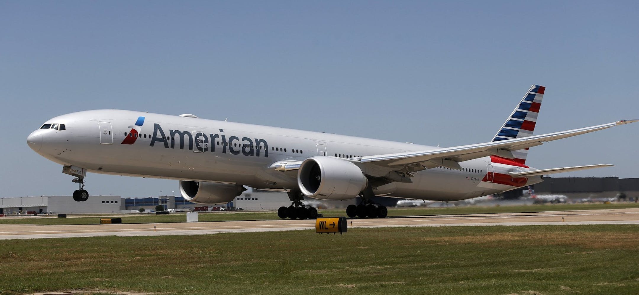 The Boeing 777-300 bound for Hong Kong rotates and takes off as American Airlines inaugurates new direct service to Hong Kong from DFW International Airport, June 11, 2014. (Rodger Mallison/Fort Worth Star-Telegram/MCT)