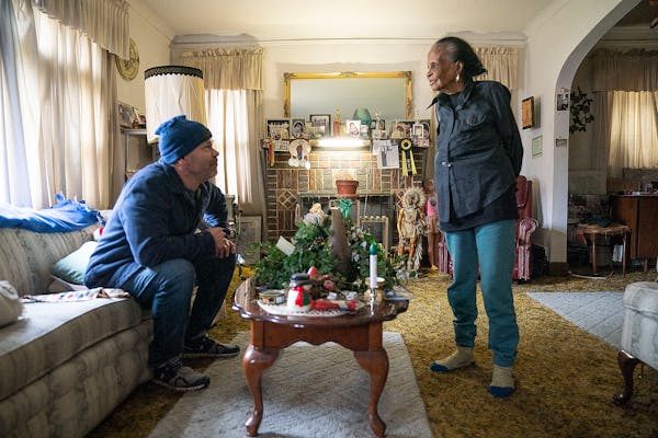Pete Magnuson chats with Marshie Allen in her home after he delivered her meals as part of the TRUST Meals on Wheels program Thursday, Nov. 18, 2021 i
