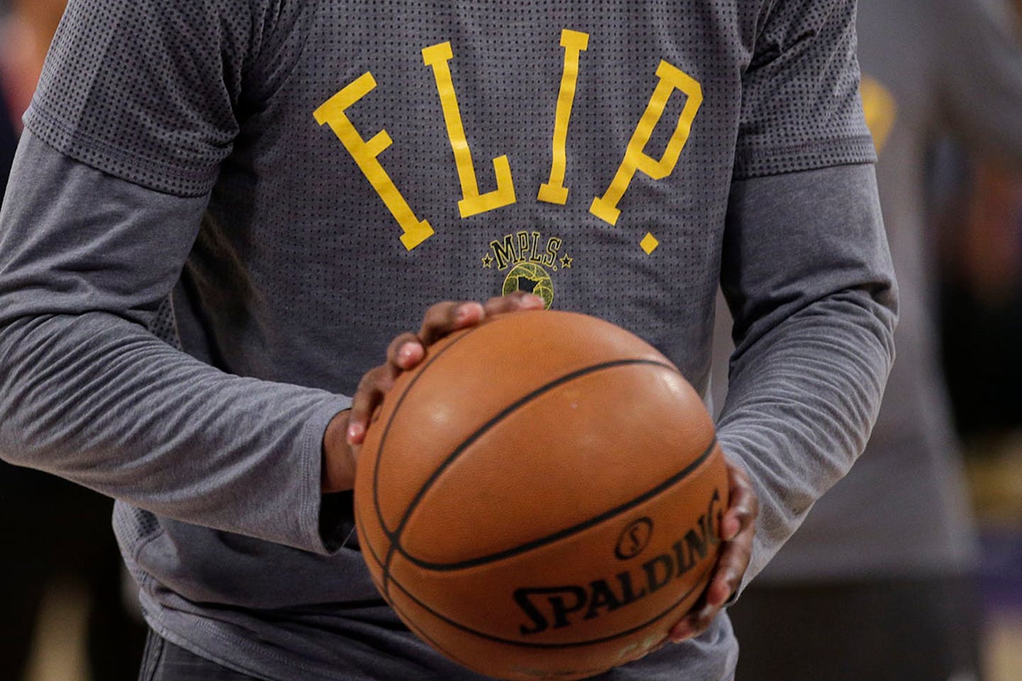 Los Angeles Lakers' Kobe Bryant wears a t-shirt in honor of Flip Saunders during pre-game warmups before an NBA basketball game with the Minnesota Timberwolves, Wednesday, Oct. 28, 2015,.