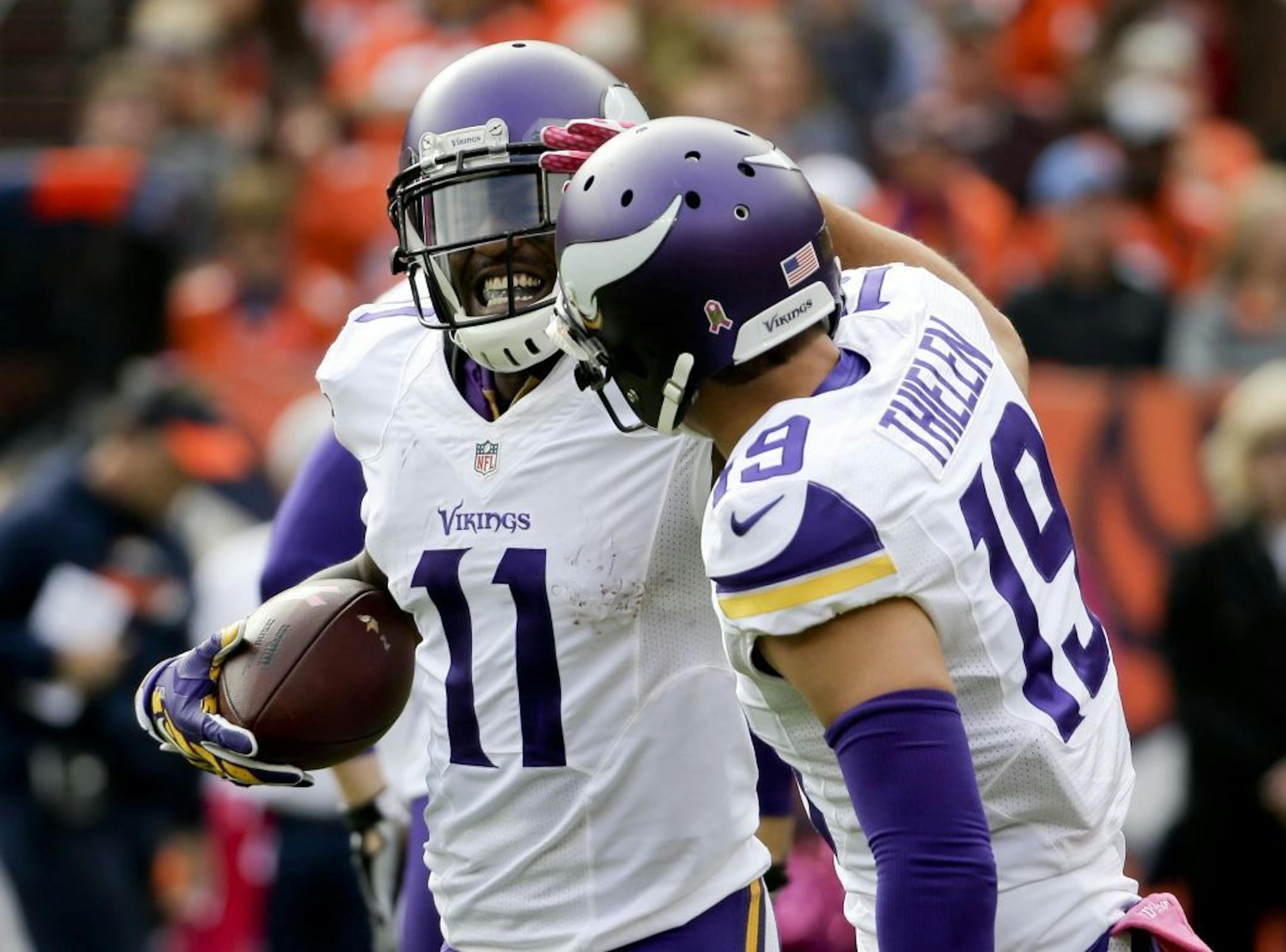 Vikings wide receiver Mike Wallace, left, celebrated after scoring with wide receiver Adam Thielen during the first half of Denver game on Oct. 4.