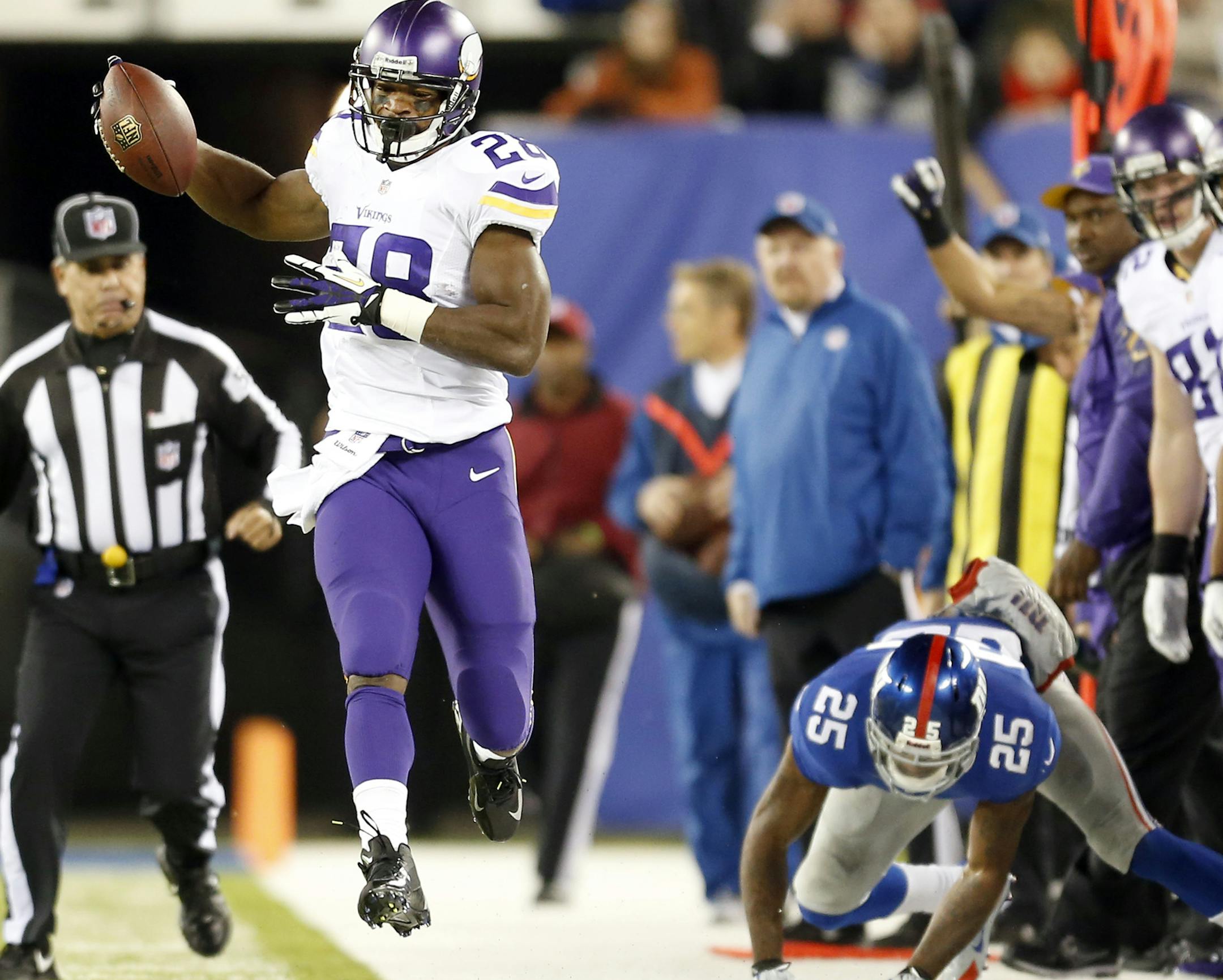 Minnesota Vikings Adrian Peterson (28) was pushed out of bounds after a catch and run in the second quarter. ] CARLOS GONZALEZ cgonzalez@startribune.com October 21, 2013, East Rutherford, NJ, MetLife Stadium, Monday Night Football, NFL, Minnesota Vikings vs. New York Giants