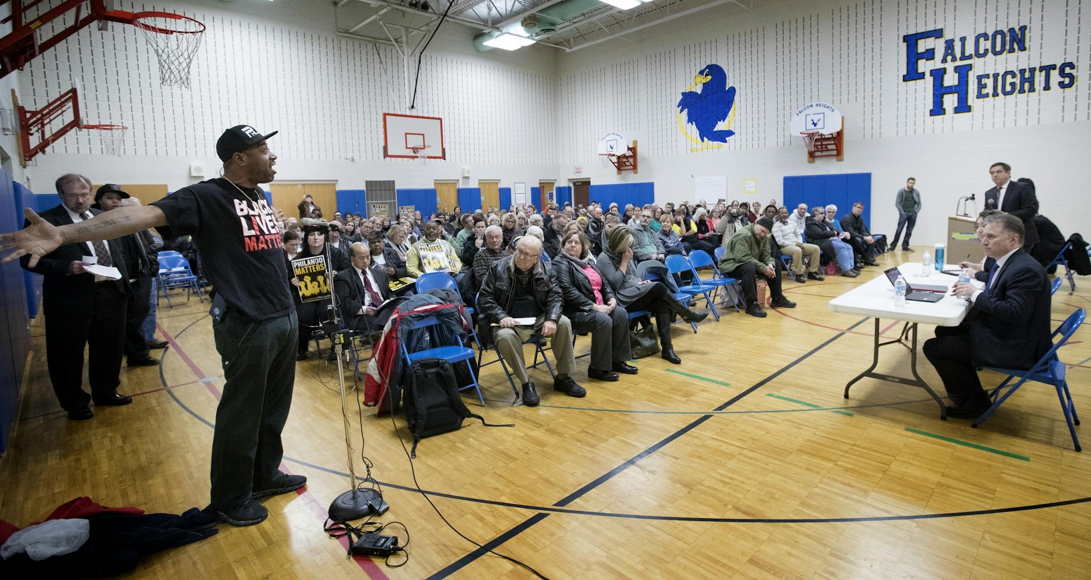 John Thompson, of St. Paul spoke during a Department of Justice listening session at Falcon Heights Elementary School on Monday night. Thompson worked with Philando Castile.