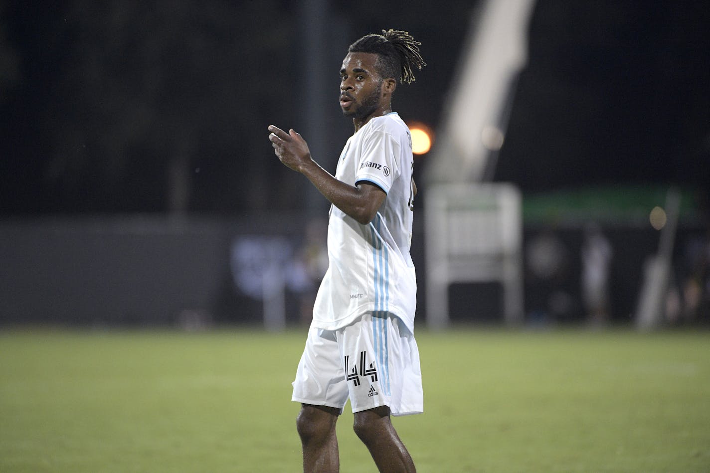 Minnesota United forward Raheem Edwards (44) follows a play during the second half of an MLS soccer match against Sporting Kansas City, Sunday, July 12, 2020, in Kissimmee, Fla. (AP Photo/Phelan M. Ebenhack)