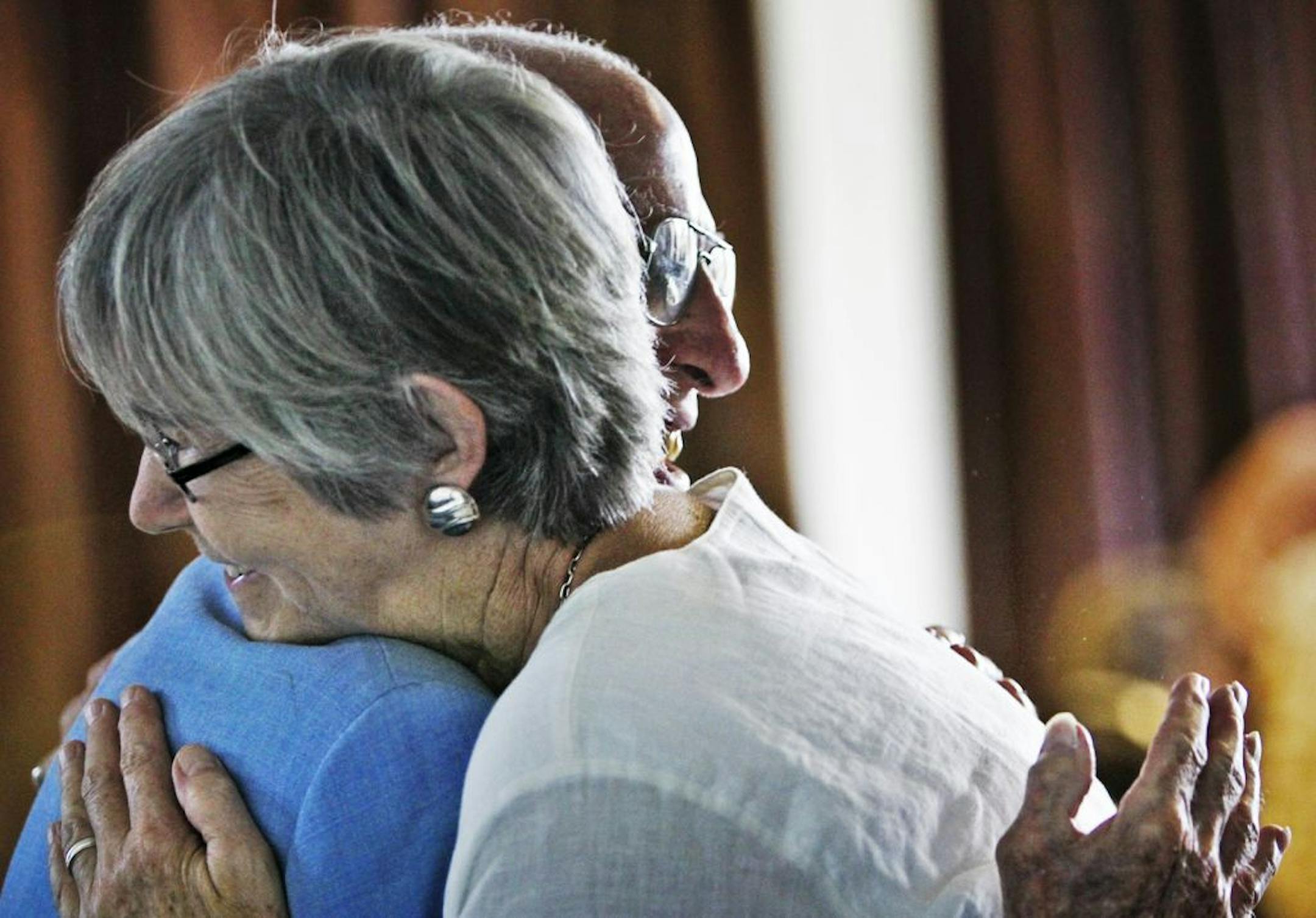 Scholarship recipient Bea Krinke embraced Queneau. "He is genuinely interested in the students," said dean John Finnegan.