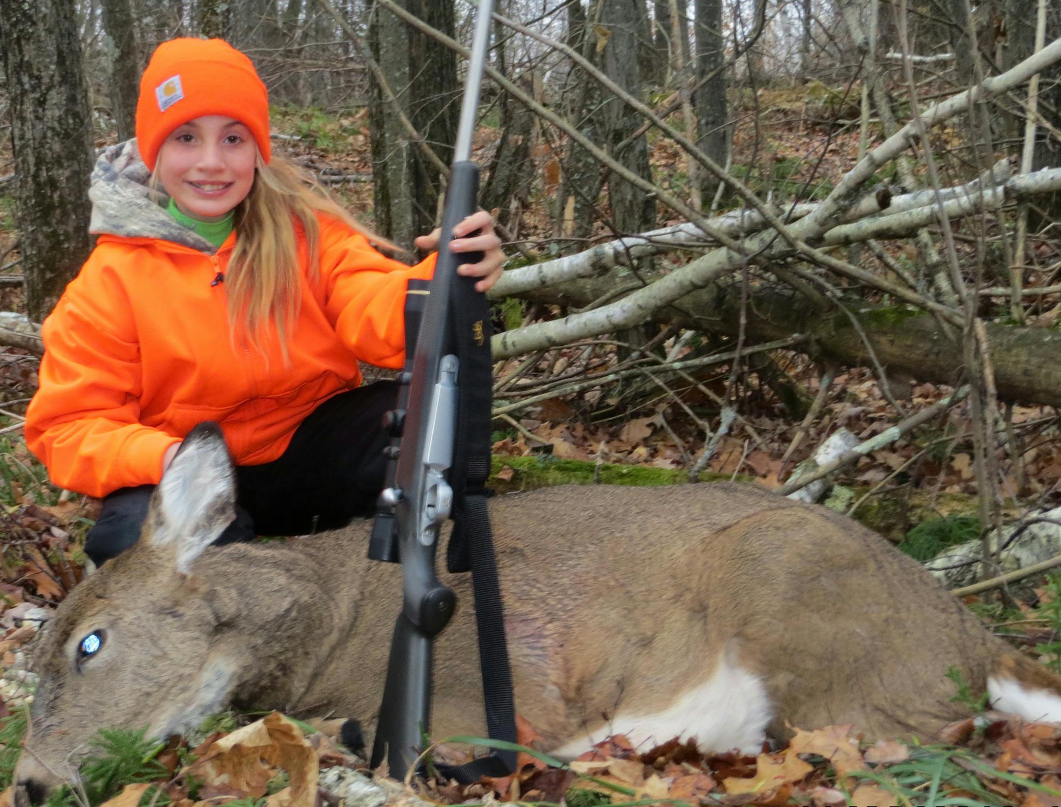 Ali Hygrel, 10, of Maple Lake, with her first-ever deer, which she bagged this fall.