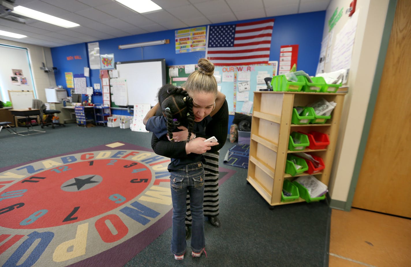 Lucy Laney School Principal Maurie Melander was greeted with hugs from her kindergarten students while they were in class with a substitute teacher Monday, March 17, 2014 in Minneapolis, MN. ] (ELIZABETH FLORES/STAR TRIBUNE) ELIZABETH FLORES &#x2022; eflores@startribune.com