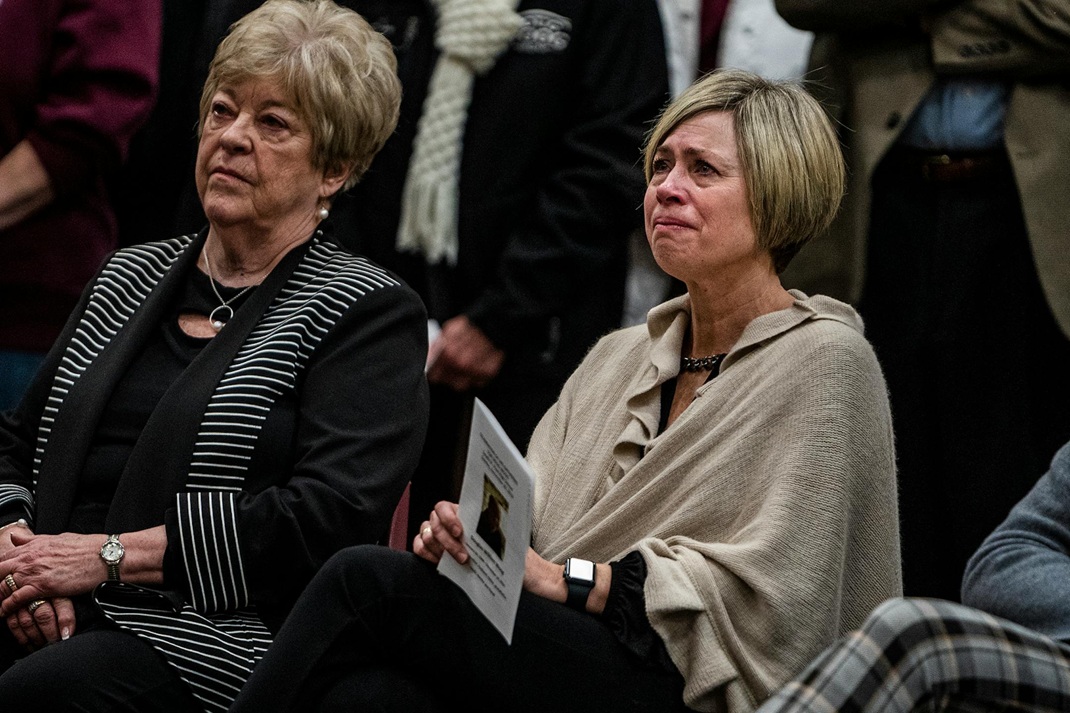 Widow Janice Woog and daughter Amy Woog Patnode listened to the eulogies during a celebration of Gophers hockey legend Doug Woog at South St. Paul High School.