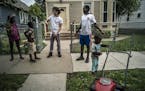 Trucker and triplex owner Moises Romo got some help from the children of his Kenyan tenants while doing yard work in the Frogtown neighborhood of St. 