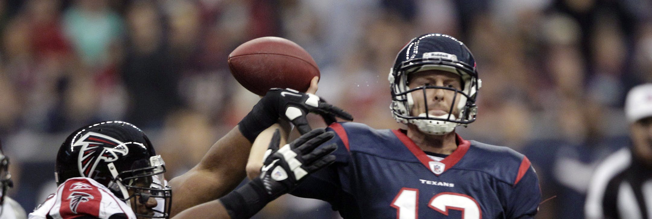 Atlanta Falcons defensive tackle Vance Walker (99) grabs the arm of Houston Texans quarterback T.J. Yates (13), causing a fumble, in first quarter of an NFL football game on Sunday, Dec. 4, 2011, in Houston. Atlanta recovered the ball. (AP Photo/David J. Phillip) ORG XMIT: MIN2013080819224832