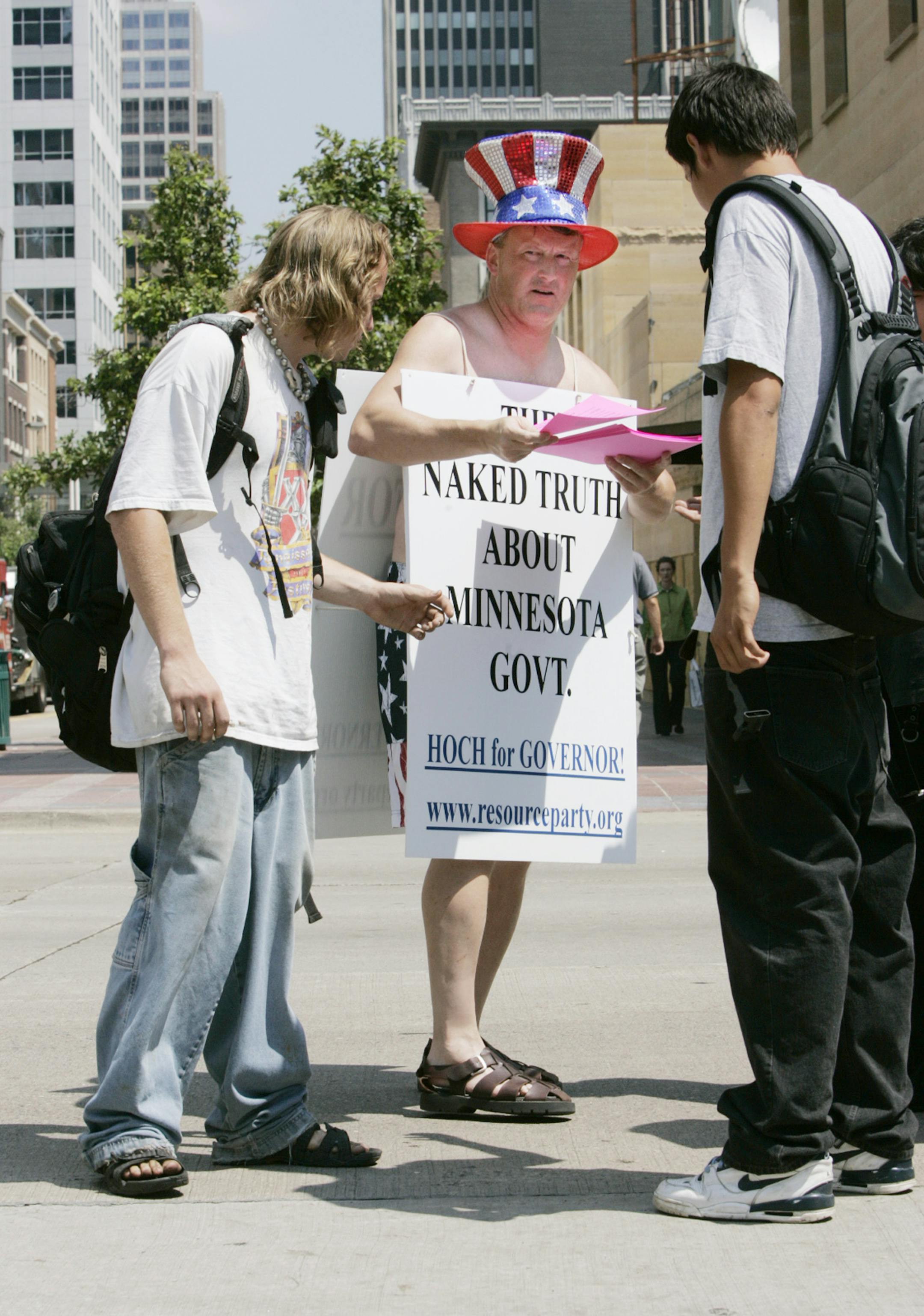 Resource Party gubernatorial candidate David Hoch hands out literature as he campaigns  with a sandwich board on Minneapolis' Nicollet Mall over the lunch hour Wednesday, July 12, 2006.  Among his campaign pledges he promises a casino which will generate $500 million additional revenue to the state and lowering of health care premiums. (AP Photo/Jim Mone)