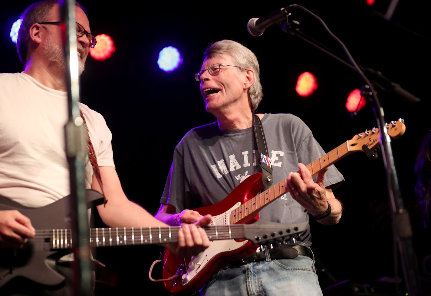 The Rock Bottom Remainders—including literary giants Stephen King, Amy Tan, Dave Barry and other writers—kicked off the Wordplay Festival Friday, May 10, 2019, at First Avenue in Minneapolis, MN. Here, Stephen King, right, jams with a band mate at First Avenue. Between band members, they've published more than 150 titles and sold more than 350 million books.]