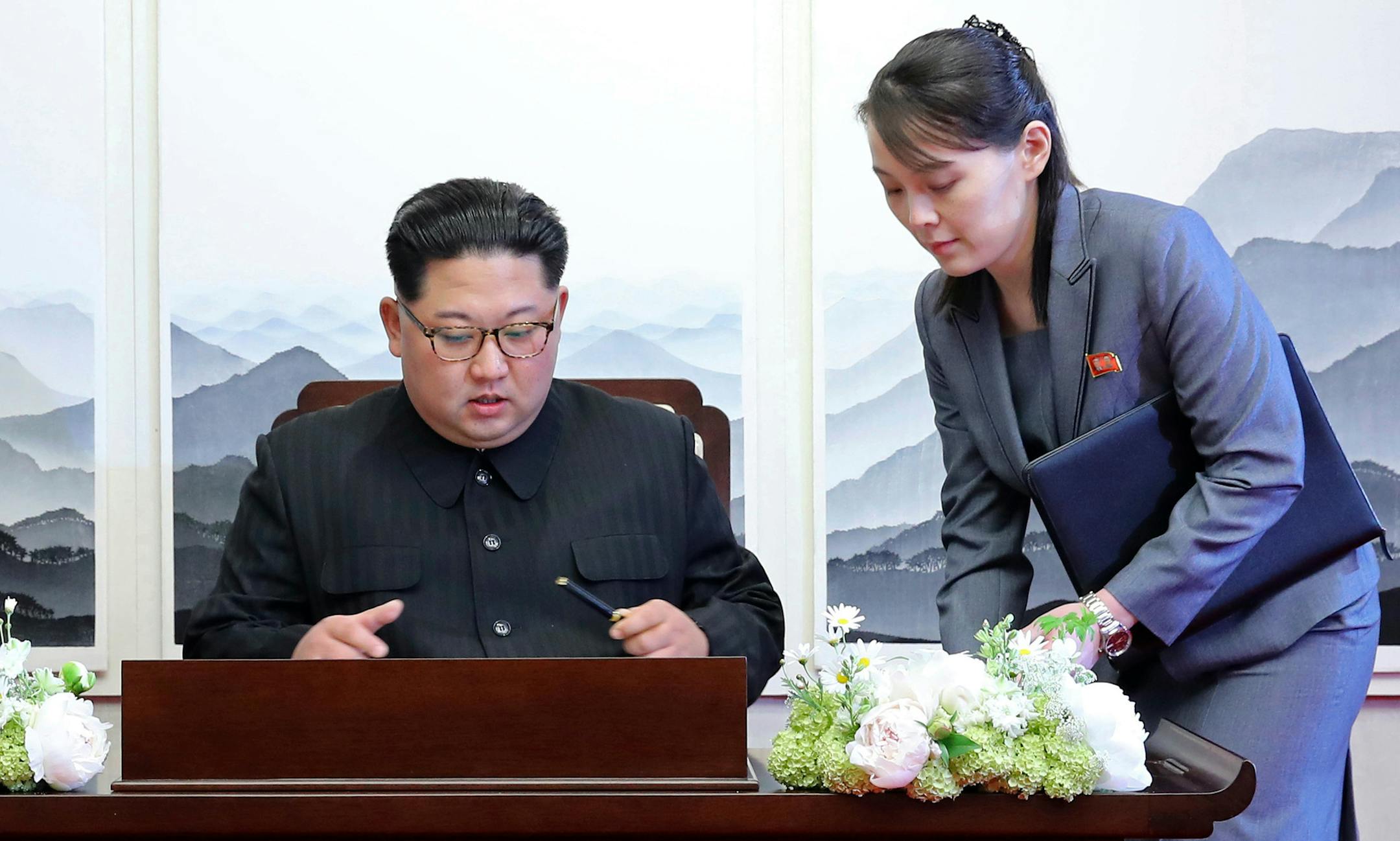North Korean leader Kim Jong Un signed a guestbook next to his sister Kim Yo Jong inside the Peace House at the border village of Panmunjom in Demilitarized Zone in April 2018.