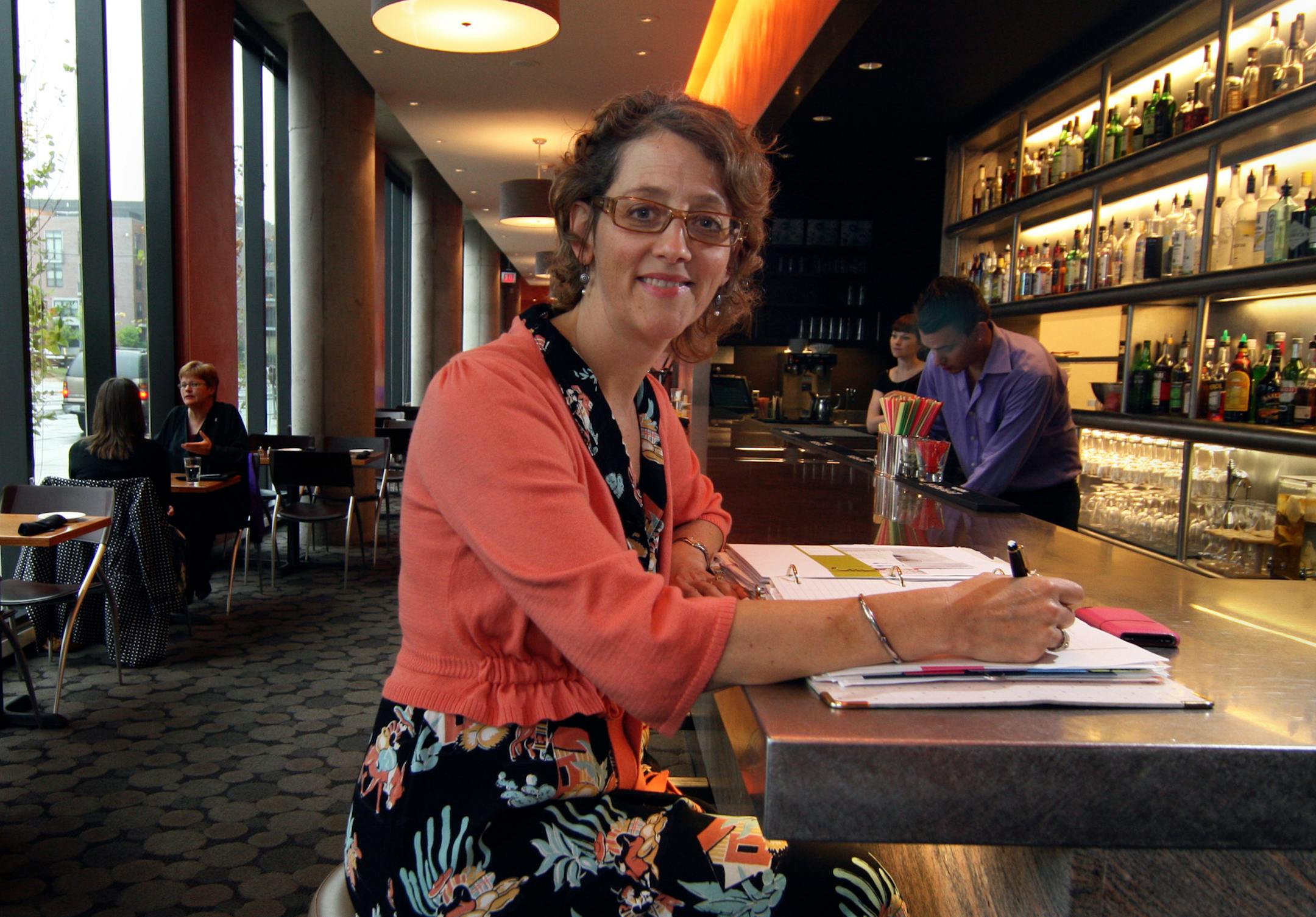 Brenda Langton, at her Spoonriver restaurant near the new Guthrie, says people are still dining out but scaling back on what they order.