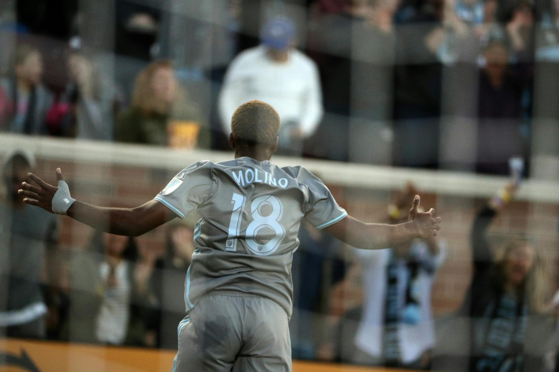 Minnesota United midfielder Kevin Molino (18) celebrates a goal on Real Salt Lake goalkeeper Nick Rimando (18) in the first half.