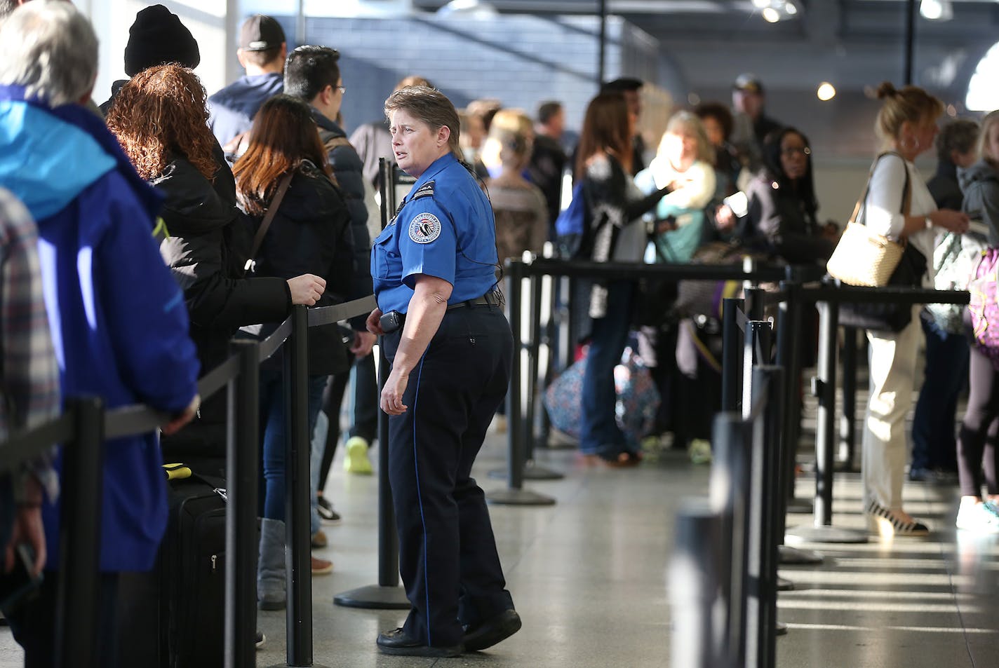 TSA security moved people through the security line at Terminal one at Minneapolis/St. Paul International Airport, Friday, March 11, 2016 in Bloomington, MN. ] (ELIZABETH FLORES/STAR TRIBUNE) ELIZABETH FLORES &#x2022; eflores@startribune.com