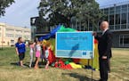 St. Paul Parks and Recreation Director Mike Hahm, with some help from children at the YMCA, announces improvements to Dickerman Park along University 