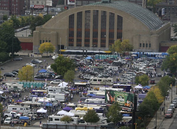 Vikings tailgaters set up camp in lots near the armory in downtown Minneapolis.
