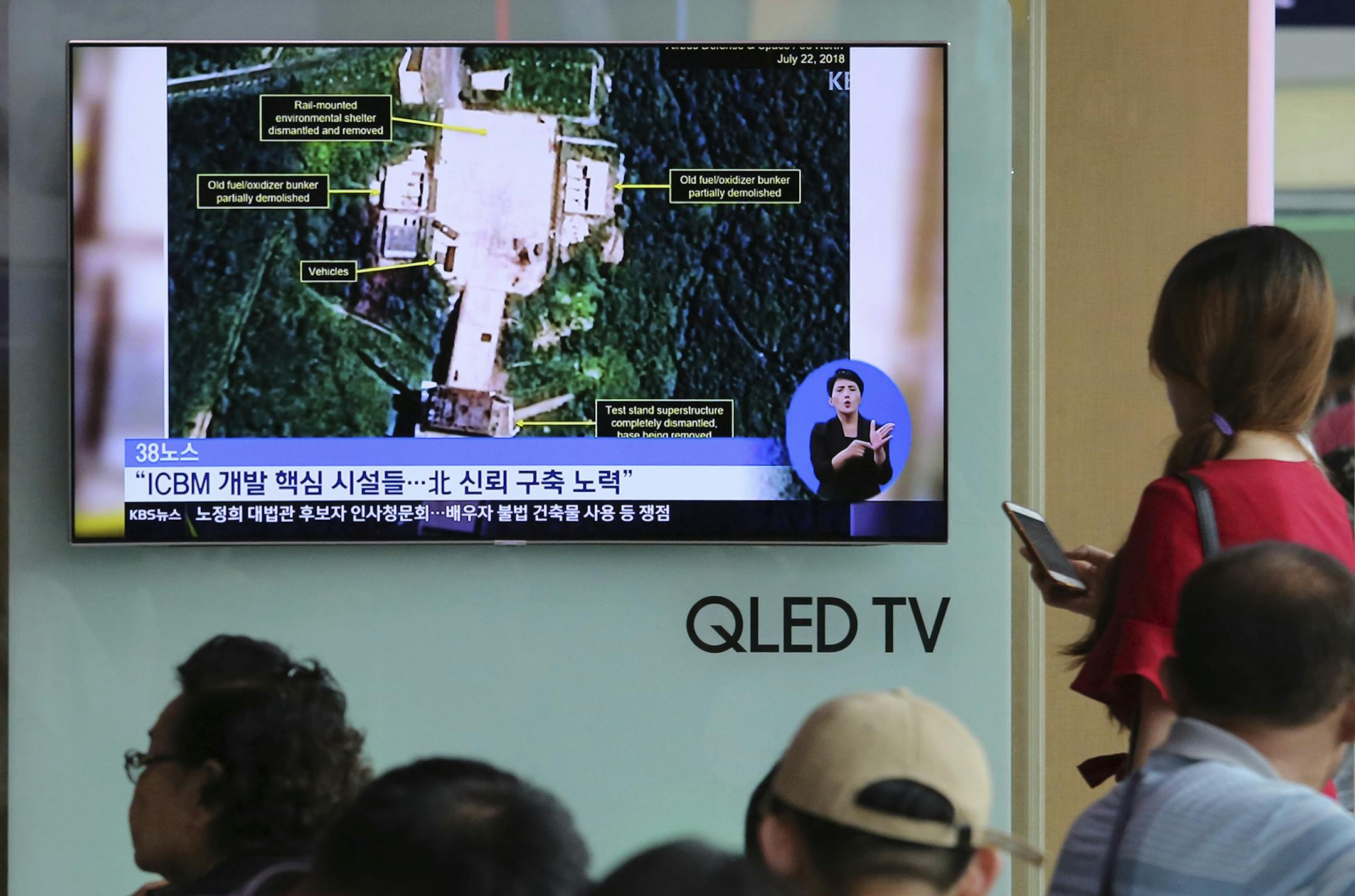 A TV screen showed a satellite image of North Korea's Sohae launch site in Seoul, July 24, 2018.The signs read: "Key facilities of an intercontinental ballistic missile (ICBM)."