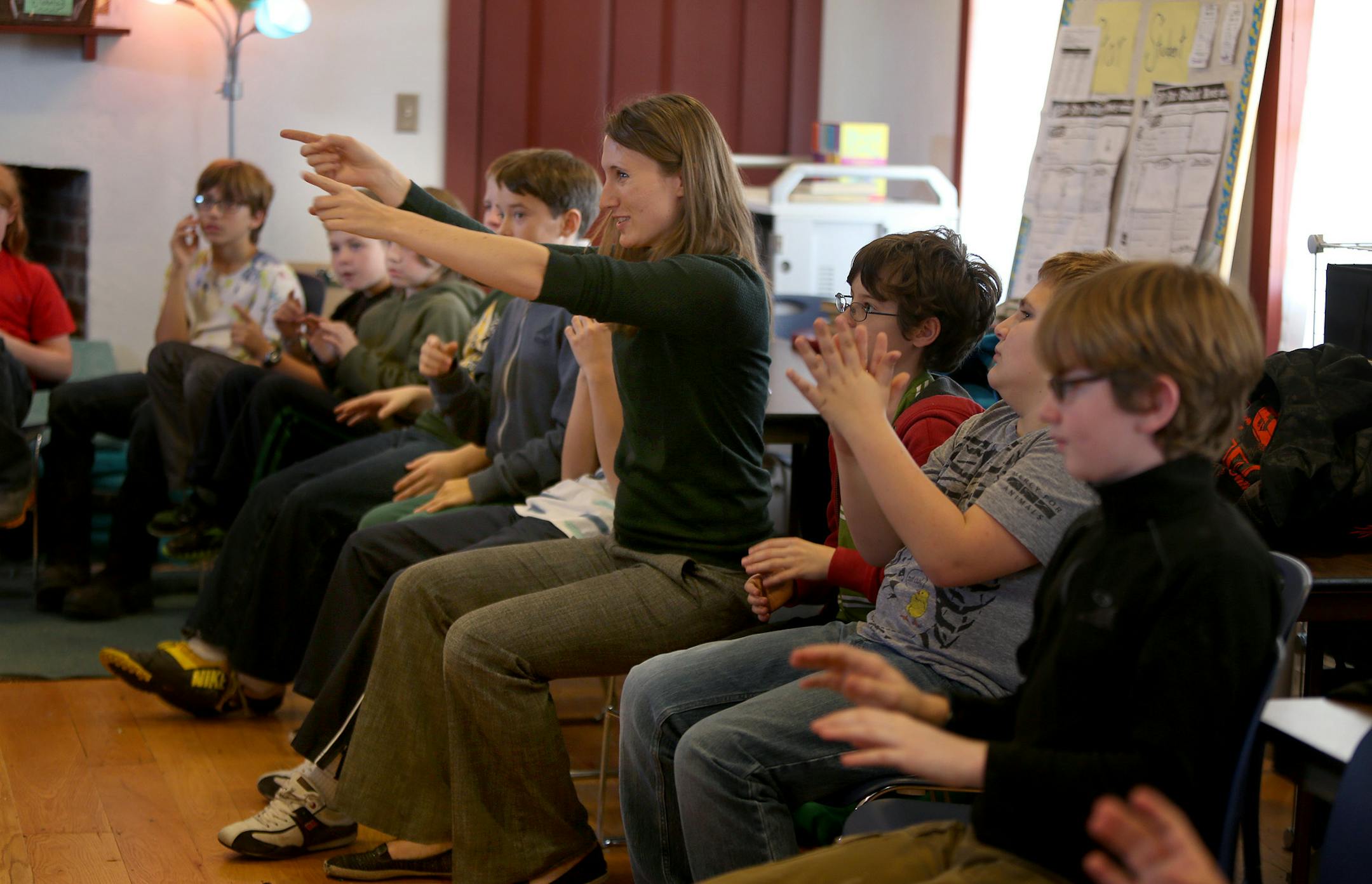 Upper Mississippi Academy music teacher Kate Gordhamer offered instruction. At other times, such as when the fort was commemorating World War I, the students heard rifle fire instead of song.