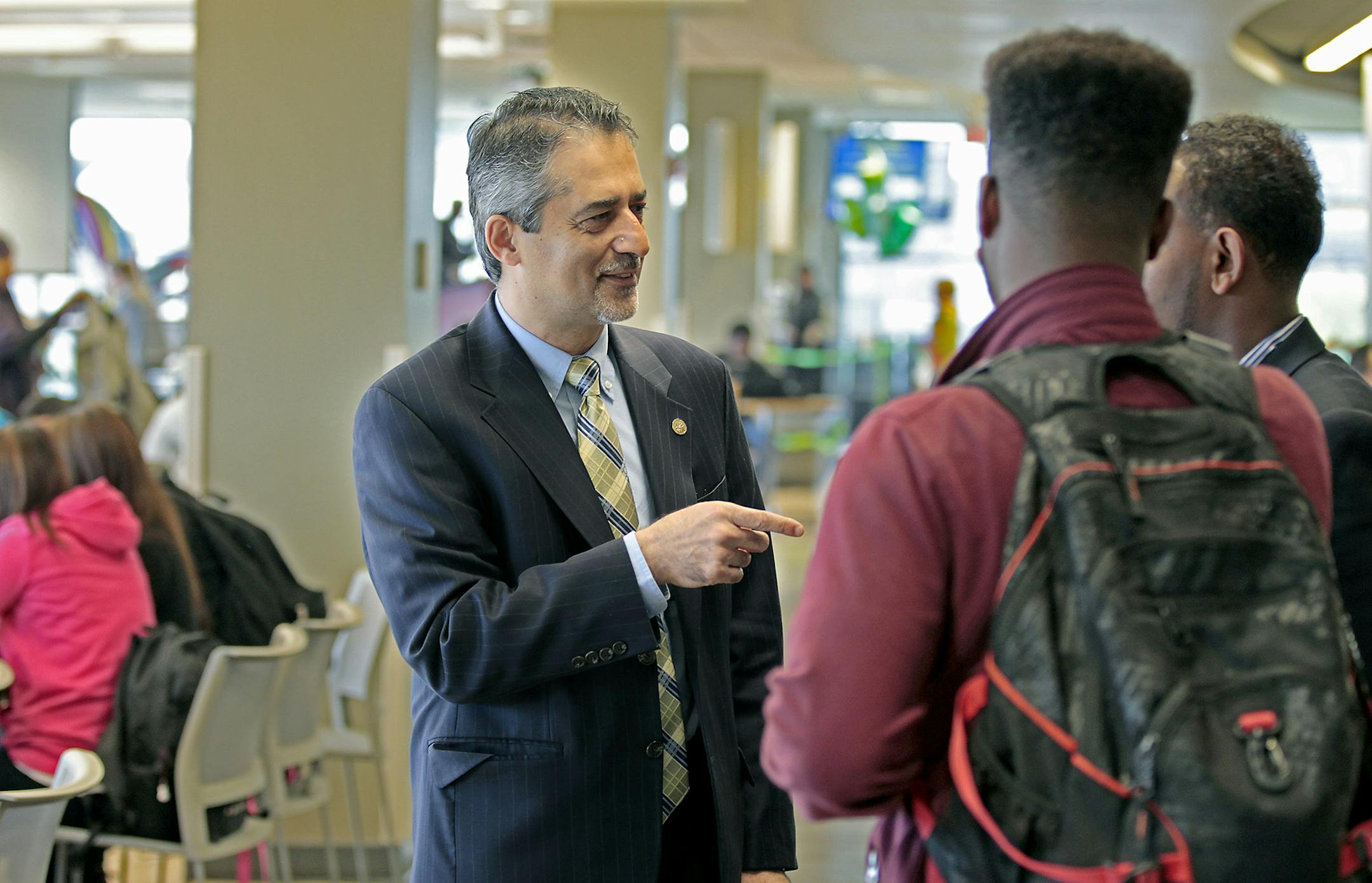 St. Paul College President Rassoul Dastmozd, an Iranian native who took the school's helm three years ago, walked the building to greet some of the students Tuesday, October 7, 2014 in St. Paul, MN. ] (ELIZABETH FLORES/STAR TRIBUNE) ELIZABETH FLORES • eflores@startribune.com