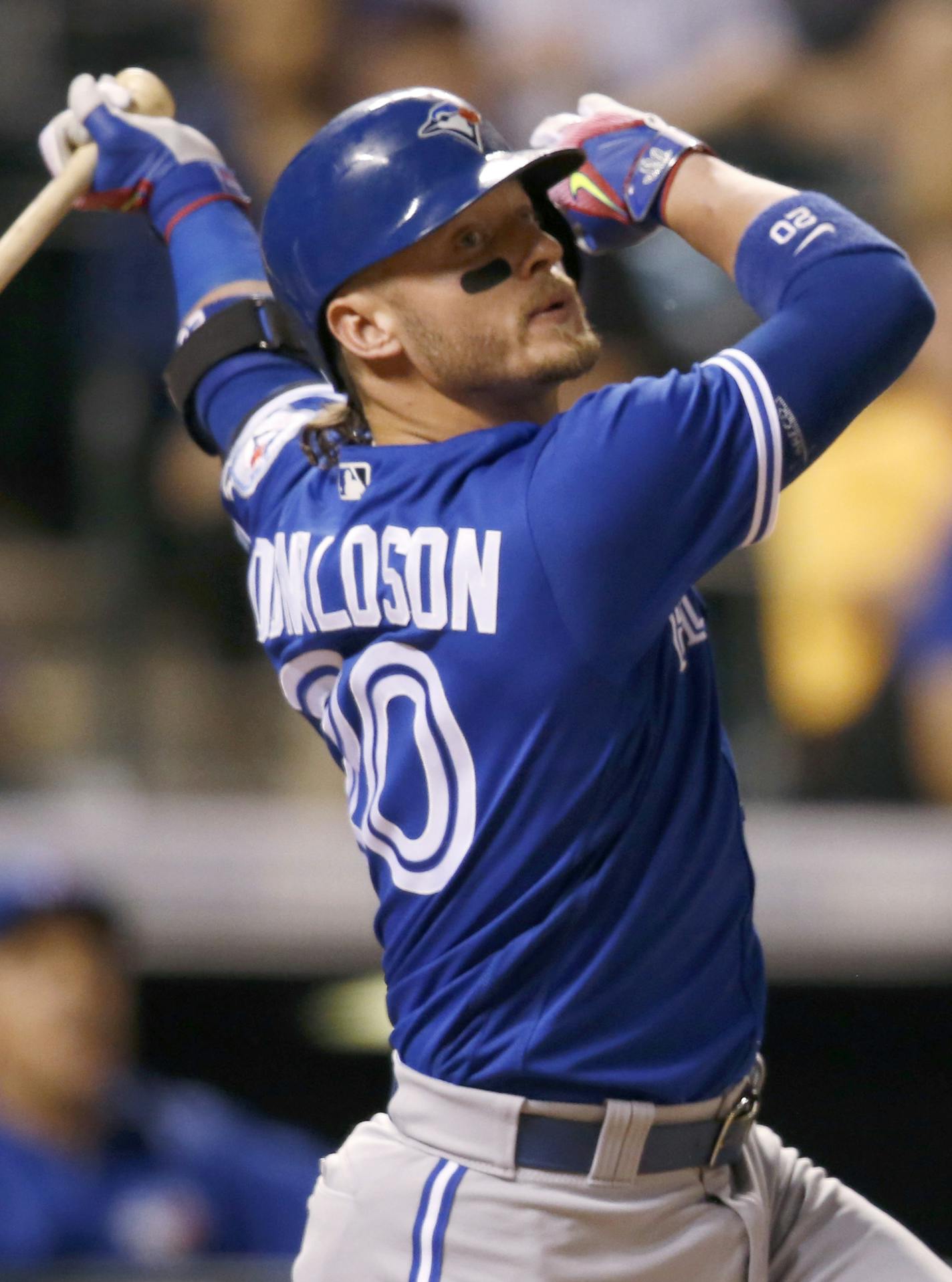 Toronto Blue Jays' Josh Donaldson follows the flight of his triple to drive in three runs off Colorado Rockies starting pitcher Yohan Flande in the fourth inning of a baseball game Tuesday, June 28, 2016, in Denver. Toronto won 14-9. (AP Photo/David Zalubowski) ORG XMIT: CODZ128