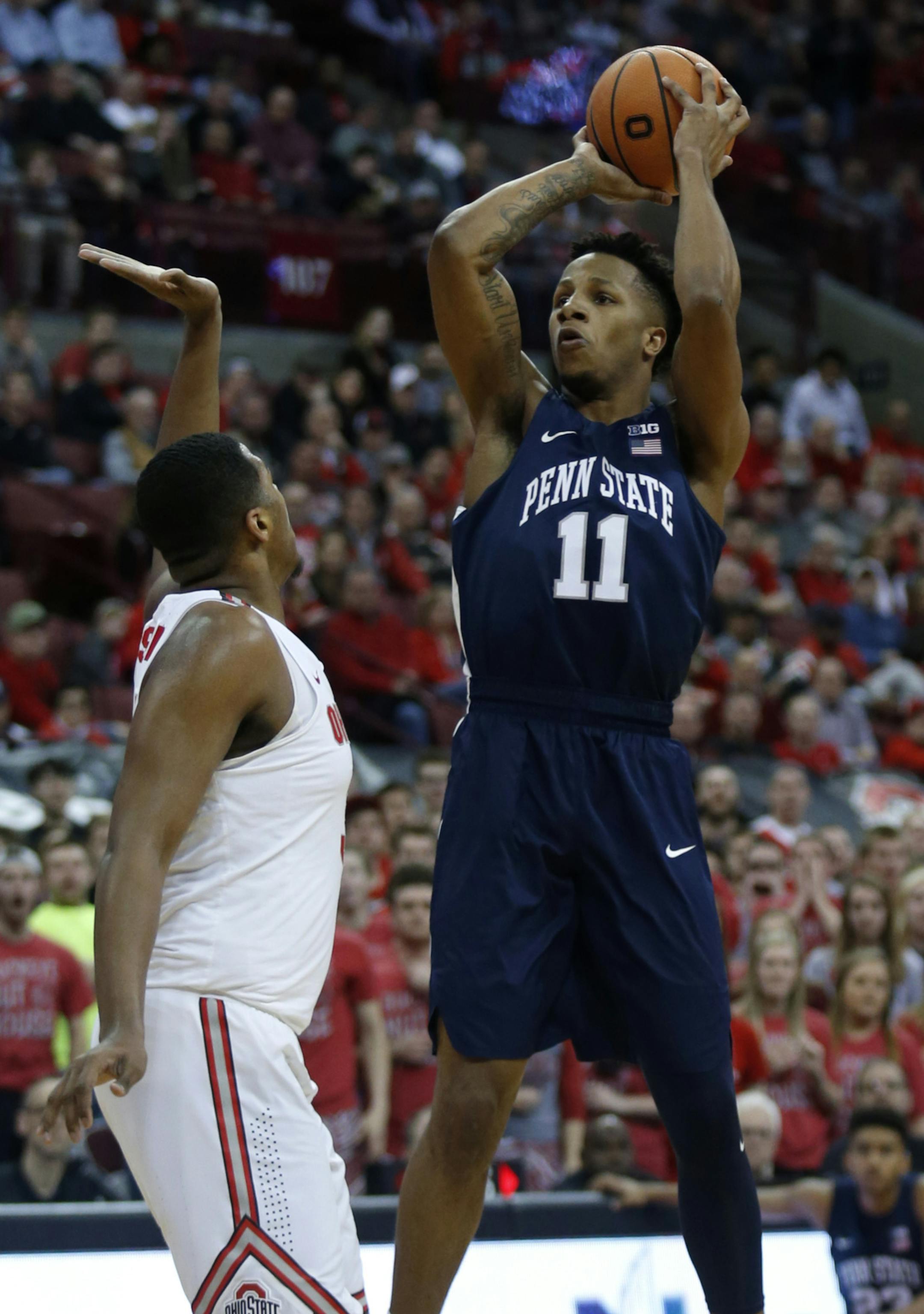 Penn State forward Lamar Stevens, right, goes up to shoot against Ohio State forward Jae'Sean Tate during the first half of an NCAA college basketball game in Columbus, Ohio, Thursday, Jan. 25, 2018. (AP Photo/Paul Vernon)