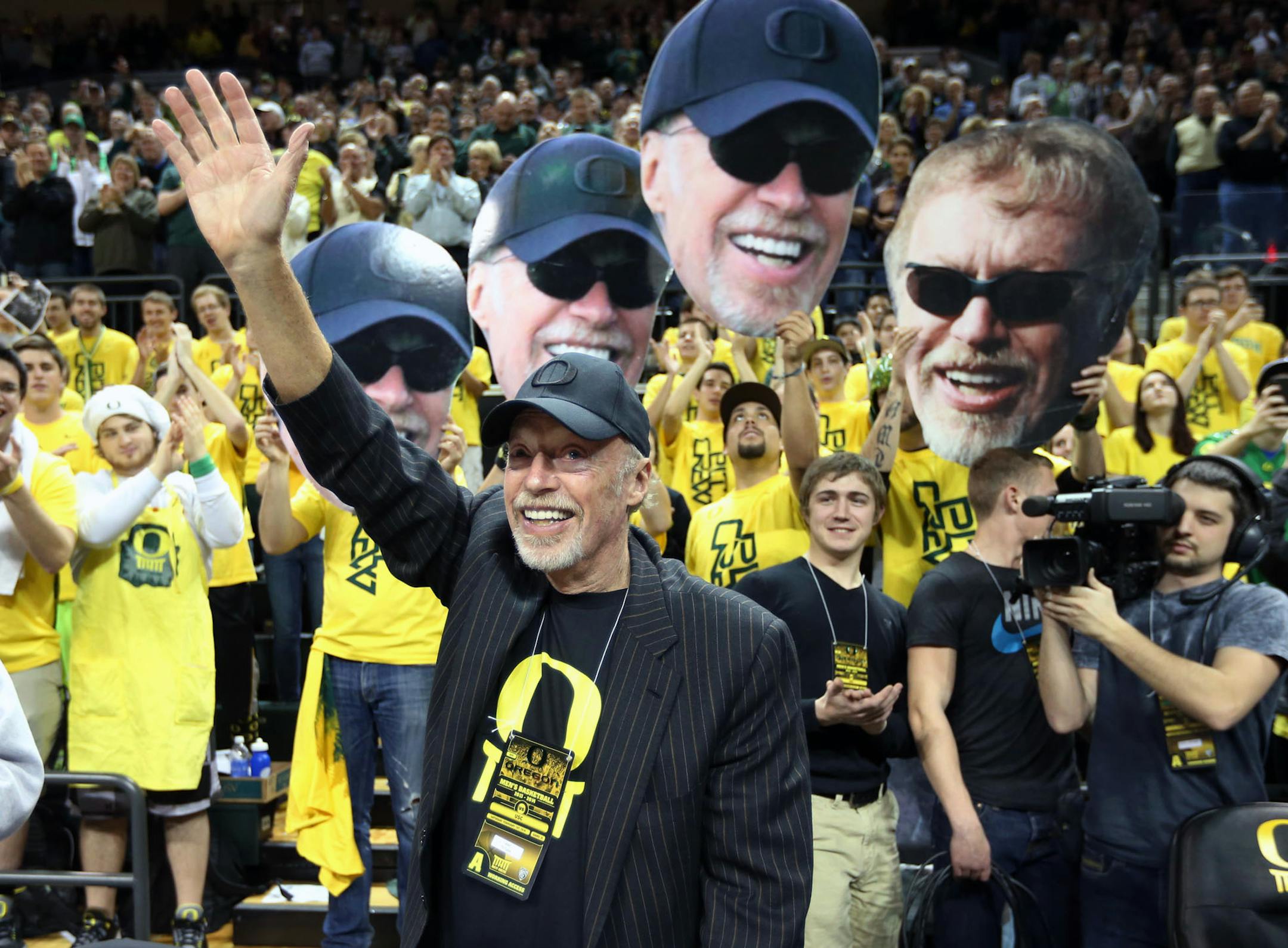 FILE- In this Feb. 1, 2014, file photo, Nike's Phil Knight acknowledges the crowd on Uncle Phil Appreciation Night at Matthew Knight Arena during Oregon's NCAA college basketball game against Southern California in Eugene, Ore. Nike said Thursday, June 30, 2016, that its' co-founder and chairman has retired from its board. (AP Photo/Chris Pietsch, File)