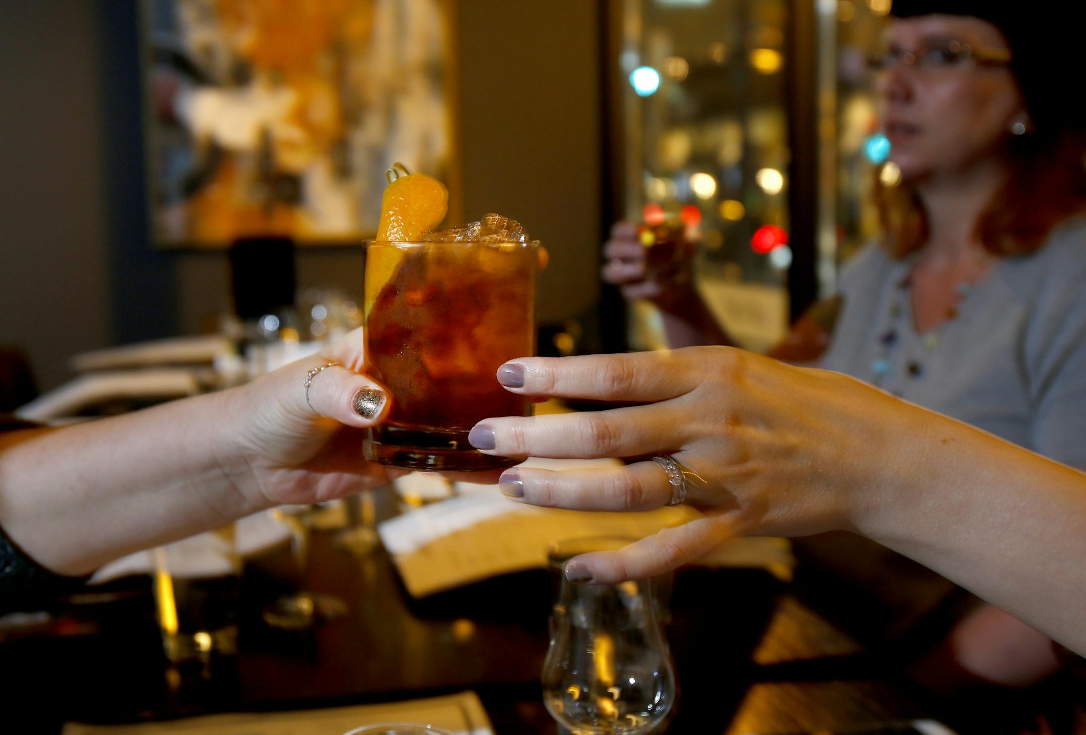 Drinks were passed around for tastes by members if Women Who Whiskey at coup d'�tat in Minneapolis.