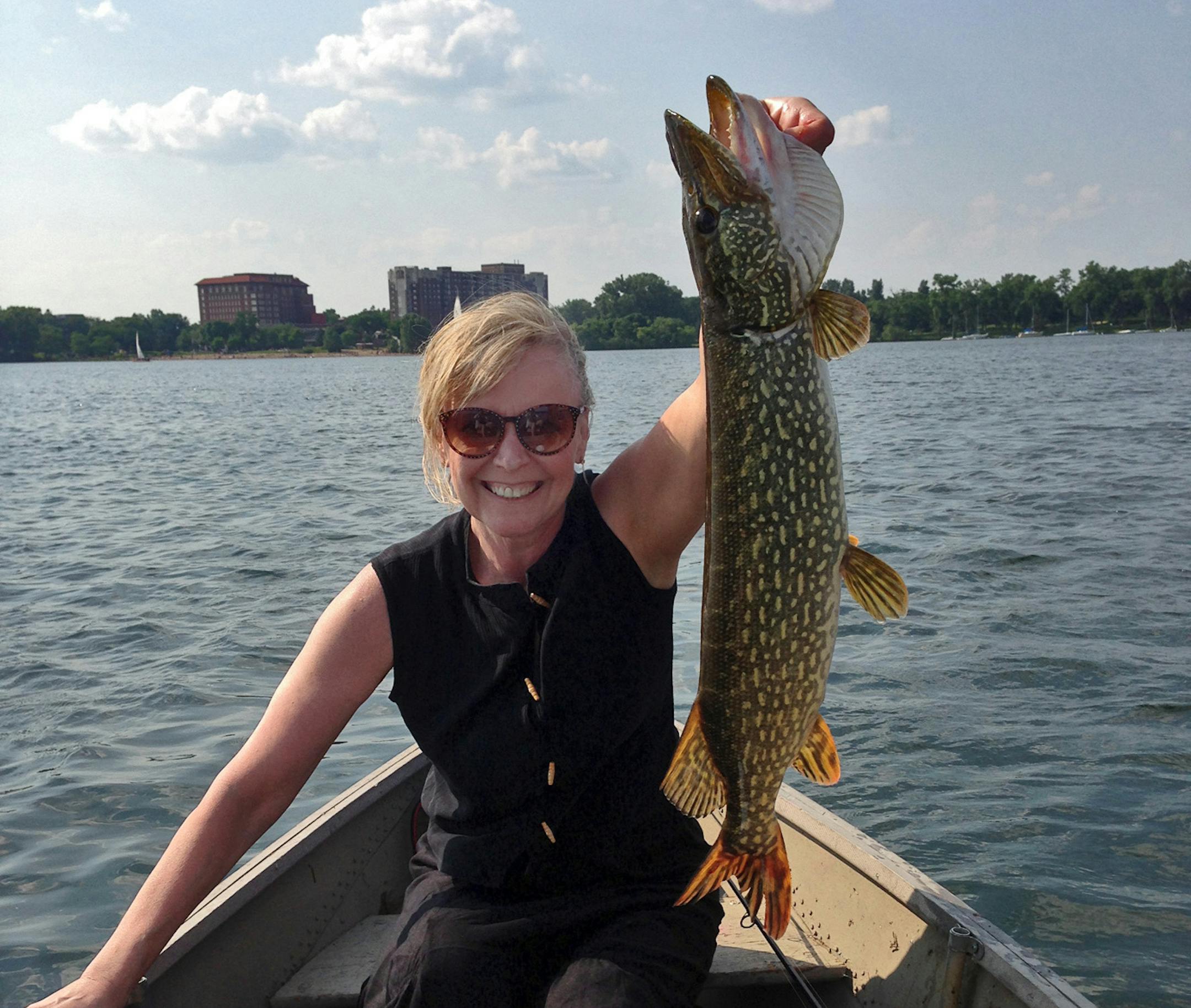 METRO NORTHERN Nancy Roettger of Minneapolis caught this dandy northern on Lake Calhoun. "For over two hours prior to her catch, she'd been reluctantly serving as the picture taker,'' said her husband, Dan. "Finally I saw her rod bend and her jaw become firmly set, like it does whenever she has an 'important' fish on.'' And photographer became subject.